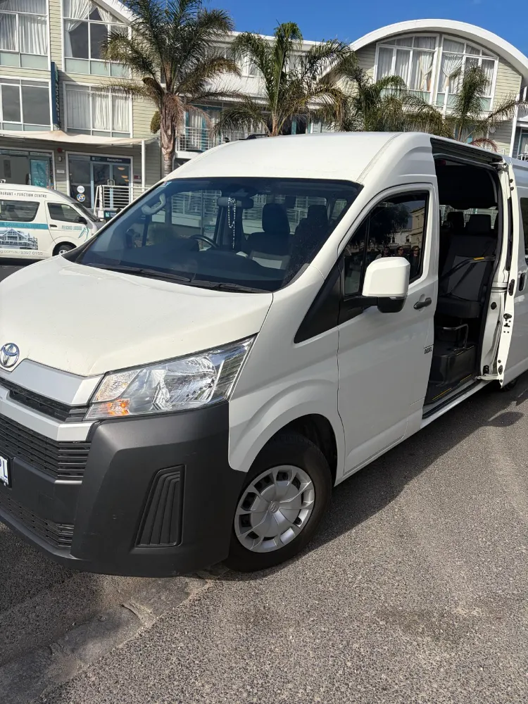White Via Emmaus Toyota HiAce passenger van