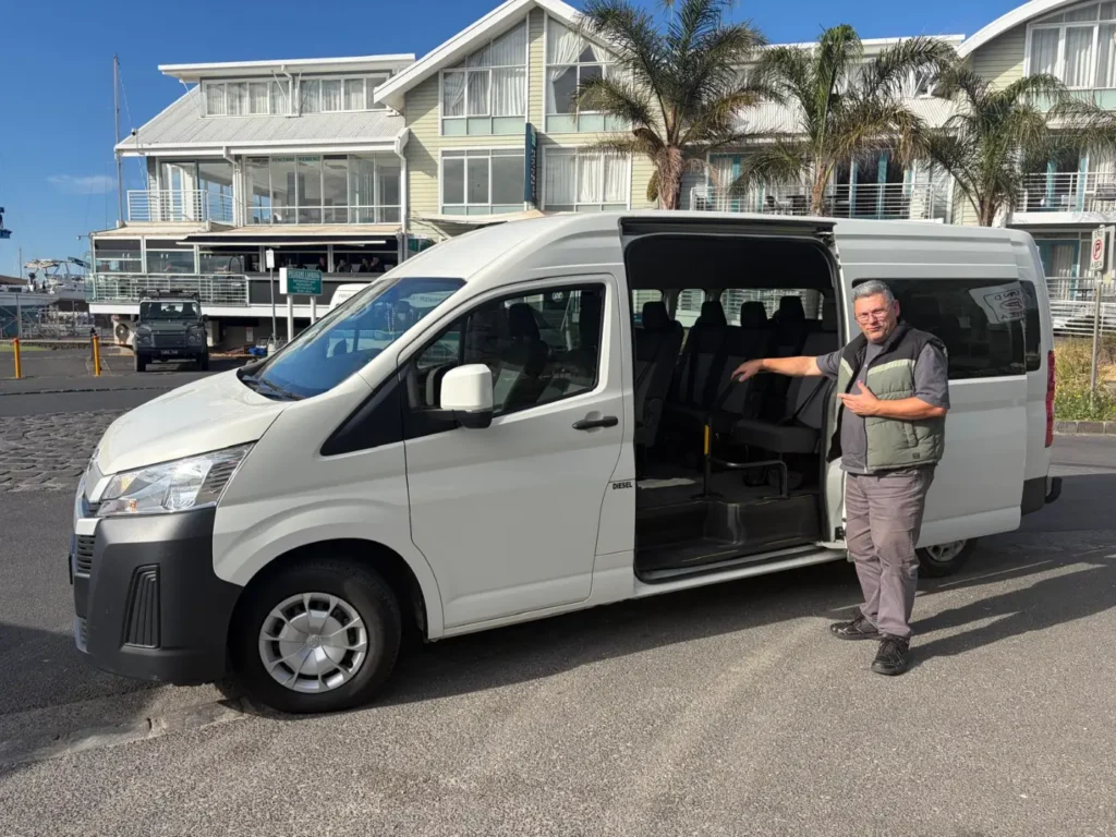 Via Emmaus Tours van with the sliding door open, ready for passengers